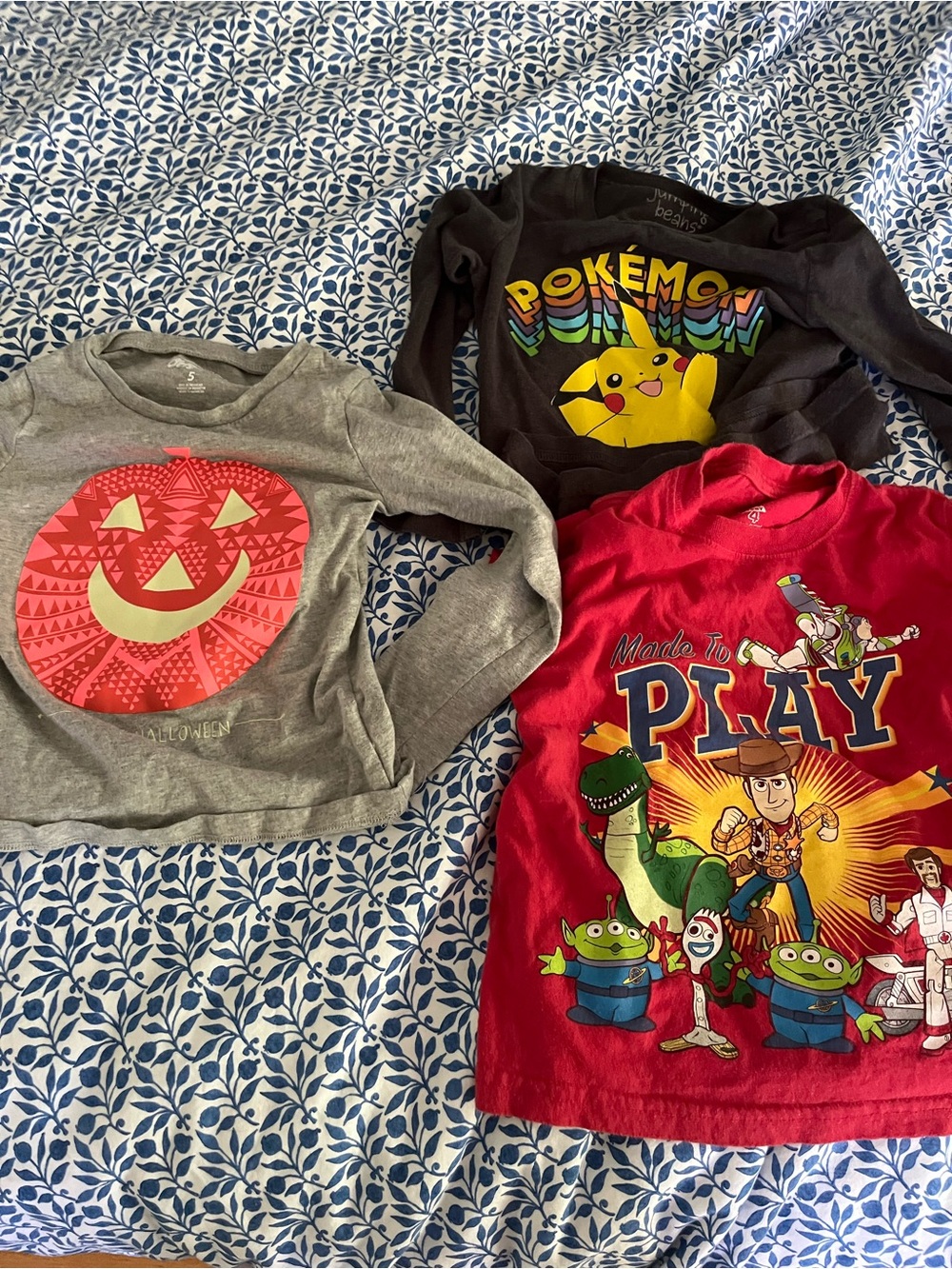 Three tees-Pokemon Pikachu, jack-o’-lantern  and Toy Story